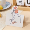 Romantic rose illustration greeting card on wooden table with warm lighting ambiance - Romance On Rose