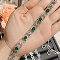 Macro detail of artificial emerald bracelet with silver metal and micro-pave crystals - Oval Green Gem Style (0028)