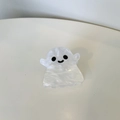 Detailed view of a ghost-shaped hair claw clip with pearlescent white acrylic finish - Ghost