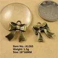 Detail of 18x16mm antique bronze bow charms for DIY jewelry making weighing 1.5g - A1265-18*16MM