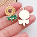 Detail view of yellow sunflower charms with enamel finish and gold-tone metal backing - Sunflower