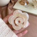 Cream-colored flower hair claw clip held by hand for elegant hairstyle styling - Cream White Camellia Claw Clip