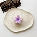 Purple gradient plumeria flower hair claw clip on a decorative ceramic tray - Small / Gradient Purple