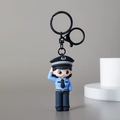 Cartoon female police officer keychain in blue uniform saluting on grey background - Police Officer Female