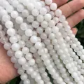 Close-up of polished white natural stone round beads for DIY jewelry making accessories - White Jade / 4mm (approximately 90 Beads) 38cm Long