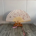 Bamboo hand fan with cherry blossom and bird patterns featuring a pink silk tassel - Peach Fan Elegance