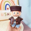 Labubu plush doll wearing brown leather jacket and blue denim jeans outfit set - Leather Baseball-style Brown Suit / First And Second Generation Keychains Are Compatible With La Cloth Dolls. Dolls Not Included.
