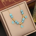 Gold chain necklace with blue turquoise beads and three butterfly pendants in a gift box - Butterfly Design