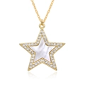 Macro view of gold five-point star pendant with micro-paved crystals and mother of pearl - White Shell Star Style (F087)