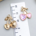 Pink heart-shaped cherry pendant in gold alloy with a ruler showing size details - Pink Stone Heart Cherry Large Left Small Right (23410)