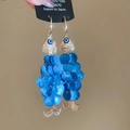 Detail of fish-shaped earrings with blue sequins, gold metal and evil eye accents - Ear Hook Gold Dark Blue Fish