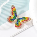 Spilla a farfalla in smalto colorato con cristalli scintillanti su elegante base in lega dorata - Colorato
