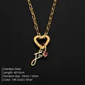 Stainless steel necklace with heart clasp, letter J pendant, and pink rhinestone detail - Letter F