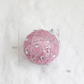 Sparkly pink 8cm foam Christmas ball with silver beads and gems on a white plush background - Pink Chain Ball