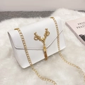 Elegant white square crossbody bag with golden deer head accent and chain strap on fur - White