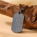 Black stainless steel US flag dog tag necklace with engraved letter S on wooden base - Letter S Necklace
