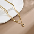 Dubbellaagse 18K vergulde slangenketting met een heldere zirkonia steen hanger - Dubbellaagse Slangenbot Witte Zirconia / Goud met witte zirkoon