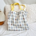Detail of blue quilted canvas tote bag featuring cute bear prints and yellow straps - Diamond Bear
