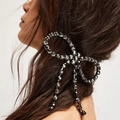 Elegant black crystal butterfly hair clip with tassel, worn by a model with long dark hair - Gunmetal