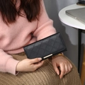Long black quilted wallet for women with elegant gold metal trim and large capacity - Black