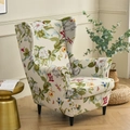 Beige floral wingback chair cover with butterfly patterns in a cozy living room - Spring Vibes