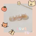 Detail of three-piece cat hair clip with pink and white gradient pearlescent finish - Pink Mermaid Shell Cat