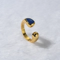 Detailed view of a gold-plated adjustable ring with a sleek blue enamel oval inlay - Blue