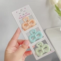Three-piece set of small bow-shaped matte hair claws in orange, light blue, and pale green - Blue Series - Bow