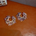 Radial sunflower earrings with iridescent baguette crystals on a brown leather surface - Iridescent Sunflower (Silver Earring Post - Iridescent)