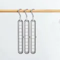 Three-pack grey 9-hole magic clothes hangers with metal hooks for space saving - Nordic Grey