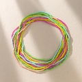 Bohemian colorful seed bead body chain with vibrant multilayered beads on textured stone - Pink Yellow & Green Mix