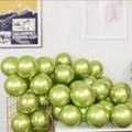 Glossy metallic green latex balloons displayed in a gold wire basket for party decor - Metallic Fruit Green - Small