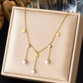 Gold star necklace with pearls and rhinestones on elegant silk jewelry box display - Five-pointed Star Rhinestone Pearl Pendant Style (N4101)