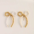 Elegant asymmetrical gold bow earrings with white faux pearls and metallic beads - Gold & White Mixed