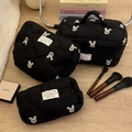 Three-piece black quilted makeup bag set featuring white bunny embroidery and top handle - Black Rabbit