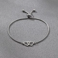 Detail of interlocking twin hearts silver bracelet with adjustable box chain bolo clasp - Silver Double Heart