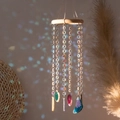 Natural agate stone wind chime with wooden ring and colorful crystals in soft sunlight - Snowflake Bell Agate Slice Wind Chime