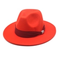 Close-up of red wool fedora hat with burgundy satin ribbon and rhinestone buckle - Orange Red