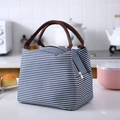 Blue and white striped lunch bag with brown handles and insulated waterproof lining - Navy Blue