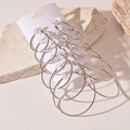 Set of 6 assorted silver hoop earrings in varying sizes on minimalist display - 6-Pair Minimalist Round Hoop Set (Steel Post)