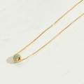 Minimalist gold necklace with spherical blue stone pendant on a fine square chain - Blue