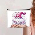 Detail of white canvas makeup bag featuring holiday gnome illustration and zip closure - Pink Hat Gnome Festive Lights (jiayingpbb0341)