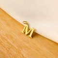 Macro detail of a golden letter M pendant on minimalist wood and fabric texture background - 14k Letter - M (letter Height 1cm)