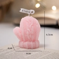 Pink knitted mitten scented candle on a book with a cozy warm bokeh background - Pink Gloves - Peach Oolong