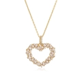 Detalle del collar con colgante de corazón dorado con cristales baguette y redondos - Dorado Blanco Circonita