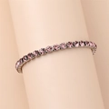 Detail of tennis bracelet with pink round-cut crystals in silver claw setting - 18cm / Pink
