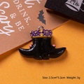 Macro view of a 3.3cm Halloween resin witch boot charm with purple spider web details - Black Boots