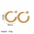 Detail view of 30mm golden twisted rope hoop earrings weighing 8.4g on white background - Gold Twisted Hoop Style (TE6051-G)