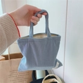 Detail of grey-blue corduroy mini handbag with side label and metal zipper closure - Light Blue