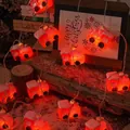 Close-up of red train Christmas LED string lights wrapped around rustic natural wood - Christmas Train Style